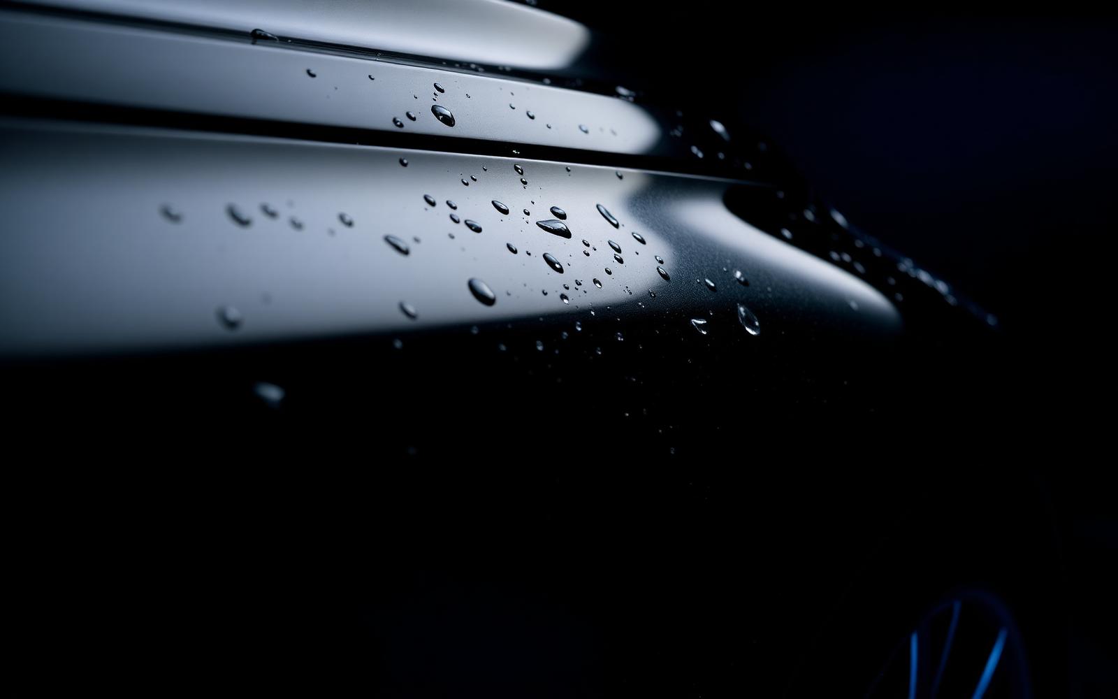 Freshly detailed car with water beading on glossy paintwork